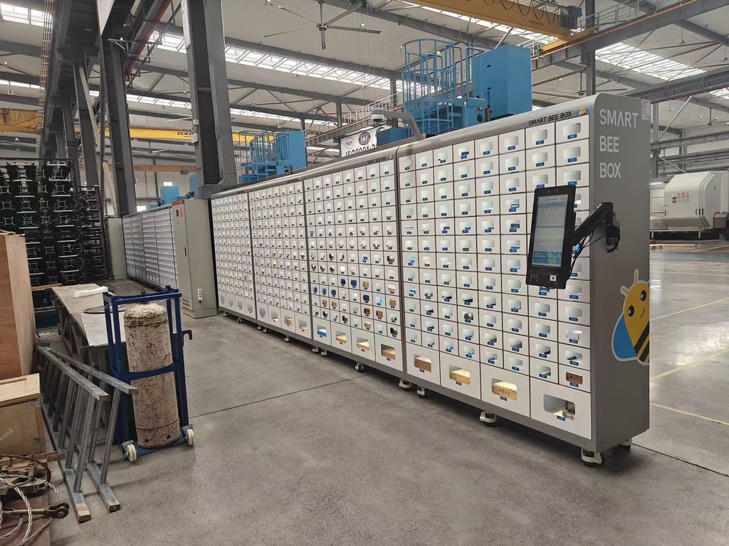 An extended bank of Origo lockers beside production equipment.