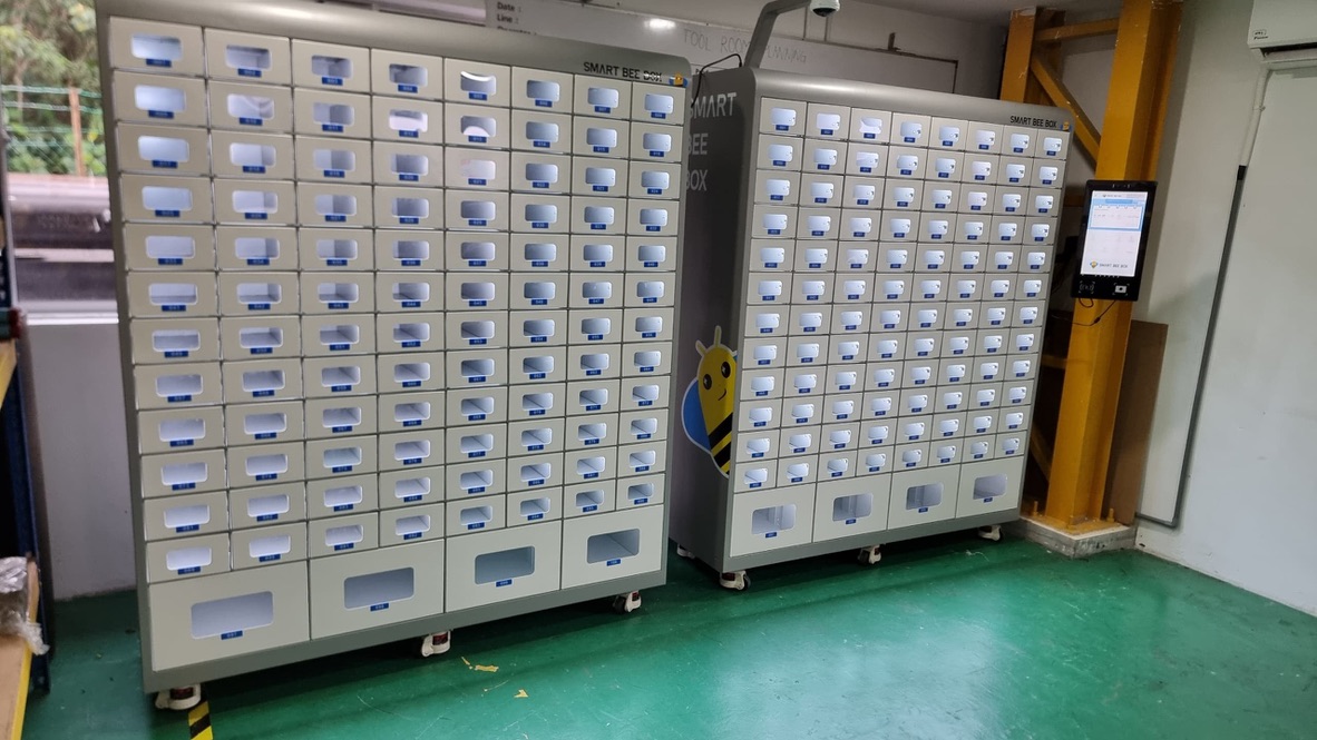 Two cabinets with a shared touchscreen interface.